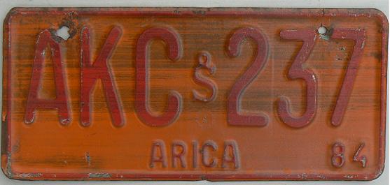 Old series (1981 - 1984), red on orange = non-private vehicles, Arica district (Tarapacá province), 1984 issue