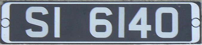 Former normal series (1921 - 1986), type 1 (the two letter code, up to four numerals), standard white/silver on black plate, SI = Dublin (1986)