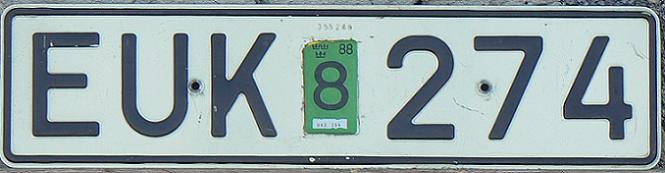 Current normal series (1972 - ), original aluminium plate issued prior to 1984, Enn = reregistering of an old vehicle, 4 (final digit) / 8 on a sticker = August