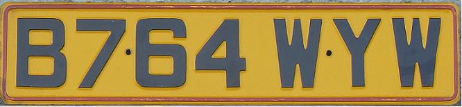 Former series (1983 - 2001), red edging = export plate (used in 1973-90), B (prefix) = registered in August 1984-July 1985, YW (2nd and 3rd suffix letter) = London, central