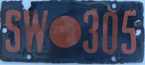 Old shire plate for horse-drawn vehicle (1924 - 1956), SW = Swan-Guildford, red on black issued between 1930 - 1956